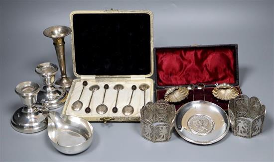 Sundry silver items, including a modern sterling pap boat, a pair of dwarf pillar candlesticks, a pair of shell salts and spoons,